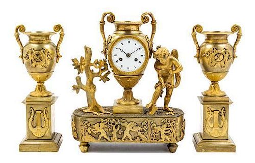 A Napoleon III Gilt Bronze Clock Garniture Height 13 x width 11 1/2 x depth 4 3/4 inches.