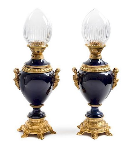A Pair of French Gilt Bronze Mounted Porcelain Fluid Lamps Height of porcelain 15 1/2 inches.