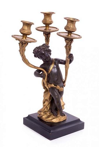 A French Gilt and Patinated Bronze Figural Three-Light Candelabrum Height 15 1/2 inches.