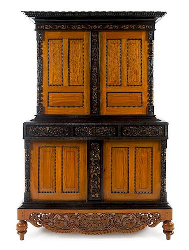 An Indo-Dutch Parcel Ebonized Satinwood Cabinet Height 84 1/4 x width 56 x depth 32 1/2 inches.