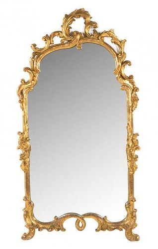 An Italian Rococo Style Giltwood Mirror Height 60 x width 32 inches.