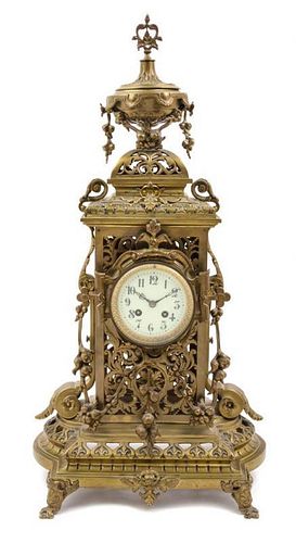 * A Neoclassical Bronze Mantel Clock Height 28 1/4 inches.