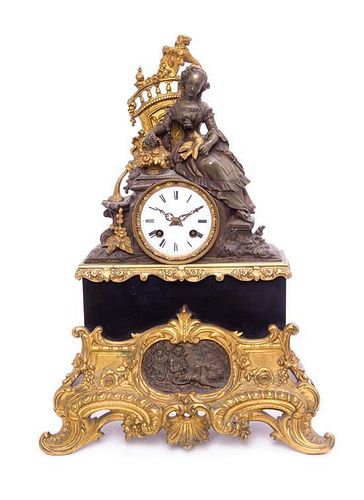 * A Continental Cast and Parcel Gilt Figural Mantel Clock Height 18 1/2 inches.