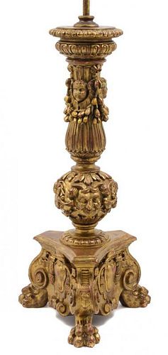 An Italian Carved Giltwood Pricket Height overall 35 5/8 inches.