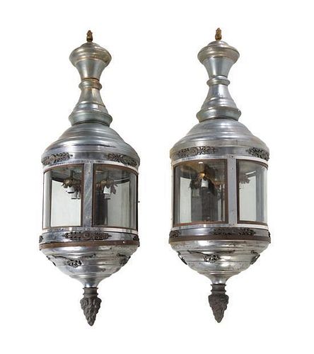 A Pair of Large Aluminum Carriage Lanterns Height 52 inches.