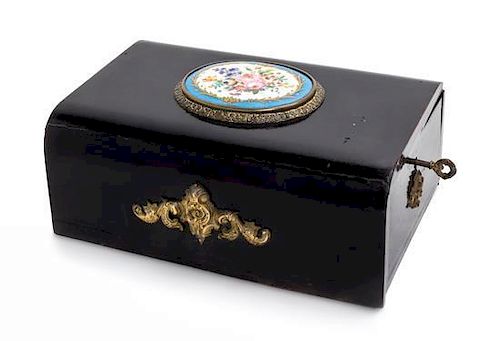 * A Victorian Porcelain Mounted Ebonized Jewelry Box Height 4 x width 10 x depth 6 1/2 inches.