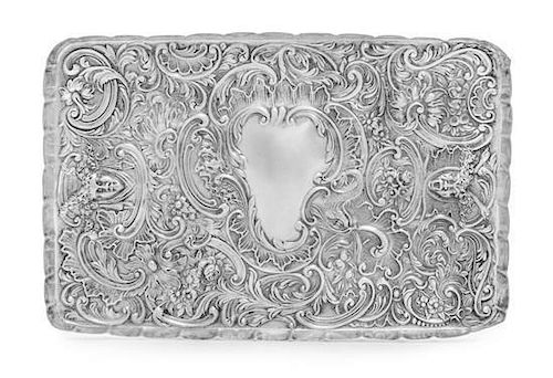 A Victorian Silver Platter, William Comyns, London, 1898, having a scalloped border, worked to show floral sprays, rocaille a