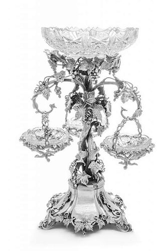 A Silver-Plate Epergne, 19th Century, the central cut glass bowl above the stem worked to show grapevines, leaves and cluster