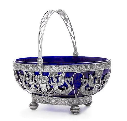 A French Silver Center Bowl, Apparently Unmarked, having a swivel handle worked to show serpent, mask and floral motifs above