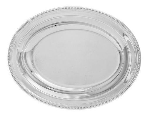 * A French Silver-Plate Vegetable Dish, Christofle, Paris, 20th Century, of oval form, with a beaded rim.