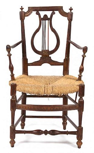 A French Provincial Carved Walnut Fauteuil Height 33 inches.