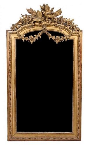 A Louis XVI Carved Giltwood Wedding Mirror Height 64 x width 35 inches.