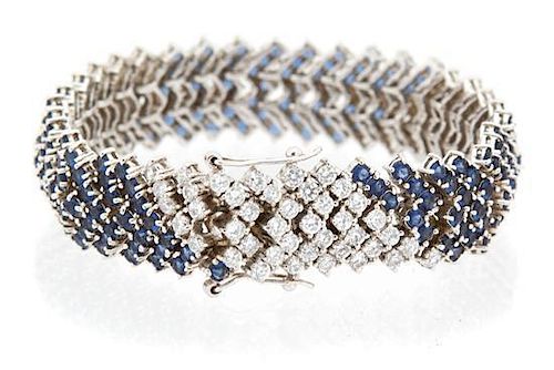 A Sterling Silver Faux Sapphire and Cubic Zirconia Line Bracelet Length 7 inches.