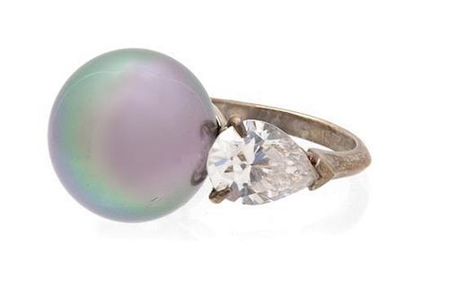 A Faux Tahitian Pearl and Cubic Zirconia Silvertone Ring