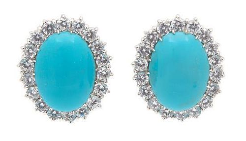 A Pair of Silvertone Faux Turquoise and Cubic Zirconia Earrings Height 1 inch.