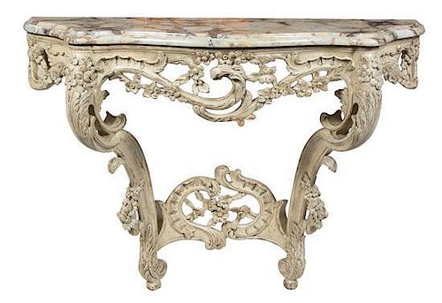 An Italian Rococo Style Carved and Painted Marble Top Console Table Height 35 1/2 x width 48 1/2 x depth 15 inches.