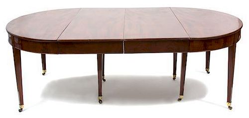 A Regency Mahogany Oval Dining Table Height 29 x width 54 x length 85 1/2 inches with leaves.
