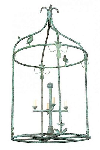 A Giacometti Style Verde Patinated Bronze Lantern Height 44 x diameter 24 inches.
