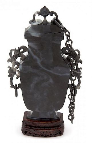 A Chinese Carved Chloromelanite Jade Urn Height 7 x width 4 x depth 1 inches.