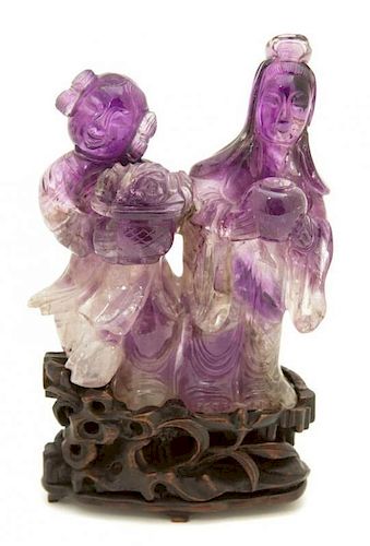 A Chinese Carved Amethyst Quartz Figural Group Height 4 x width 3 x depth 1 inches.