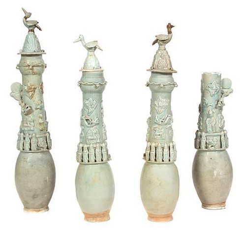 A Group of Four Chinese Celadon Glazed Funerary Urns Height of tallest 32 inches.