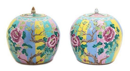 A Pair of Chinese Famille Rose Porcelain Covered Jars Height 9 x diameter 8 1/4 inches.