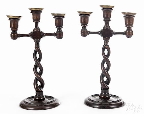 Pair of English oak candelabra, late 19th c., with brass bobeches, 13 1/2'' h.