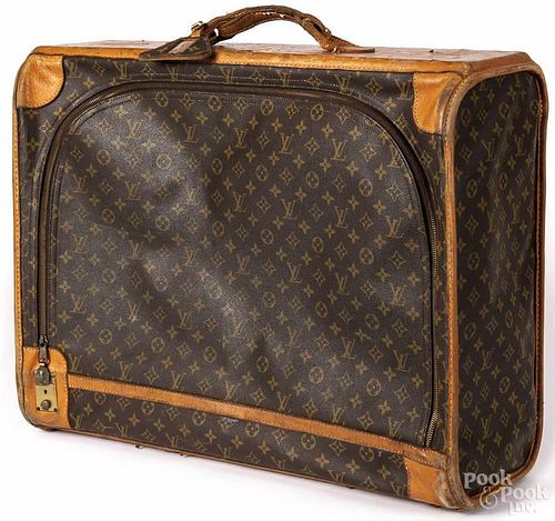 Louis Vuitton monogrammed suitcase, 20 1/2'' h., 25 1/2'' w.