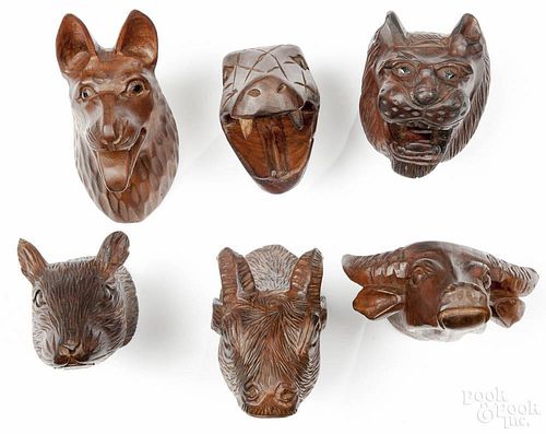Six Tai carved wood animal heads, mid 20th c., longest - 7''.