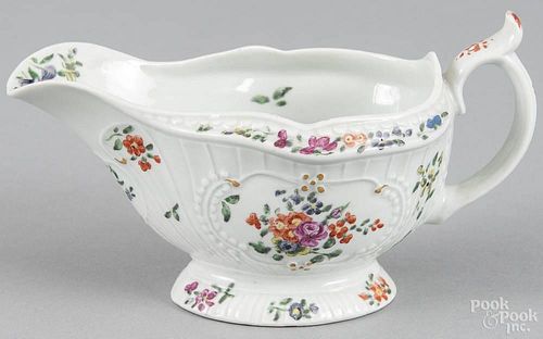 Worcester porcelain sauce boat, late 18th c., with polychrome floral decoration, 3 1/2'' h.
