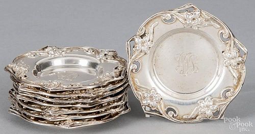 Set of eight Dominick and Haff sterling silver condiment dishes with art nouveau floral borders