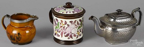 Copper lustre mush mug, with a lid, 6 3/4'' h., together with a silver resist teapot, 5 3/4'' h.