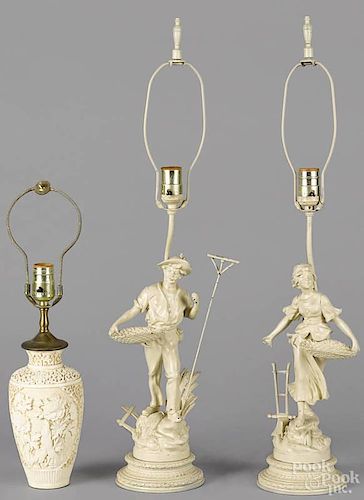 Pair of painted spelter table lamps, early 20th c., together with a composition table lamp