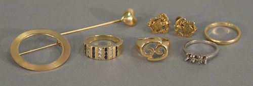 14K gold lot with two rings, one set with diamonds and sapphires, a circular pin, pair of earrings, and stick pin. 3.2 grams