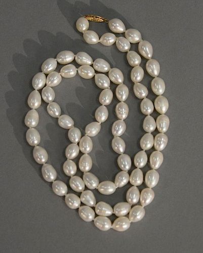 String of cultured pearls with 14 karat clasp. 9mm, lg. 34in.