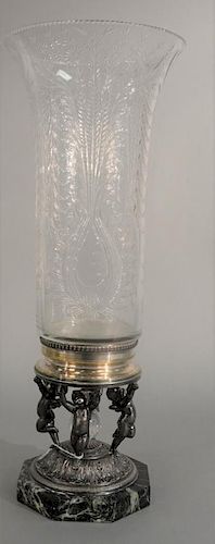 Pairpoint etched glass crystal vase on silverplate figural base having four putti figures holding vase base, signed on base.