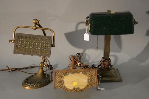 Three desk lamps including two panel shade and one emerald lite style (one very low). ht. 5 1/2in., 16in., & 16in. Provenance
