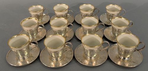 Twelve sterling silver demitasse cups and saucers with Lenox inserts, one insert non matching. height of cup without liner: h