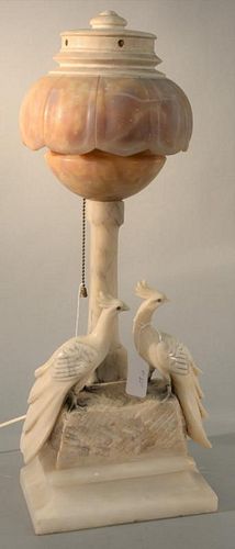 Alabaster table lamp with wood top and two peacocks on base. ht. 22in. Provenance: Property from the Estate of Frank Perrotti