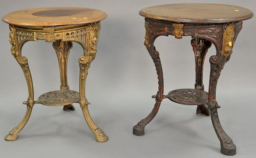 Two round top tables with iron bases, non matching. dia. 25 1/2in. Provenance: Property from the Estate of Frank Perrotti Jr.