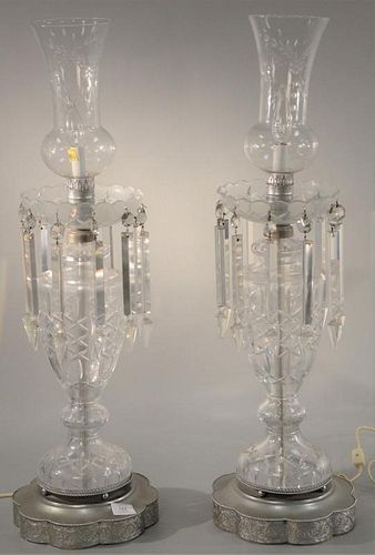 Pair of cut crystal hurricane lamps. ht. 32in. Provenance: Property from the Estate of Frank Perrotti Jr. of Hamden, Connecti