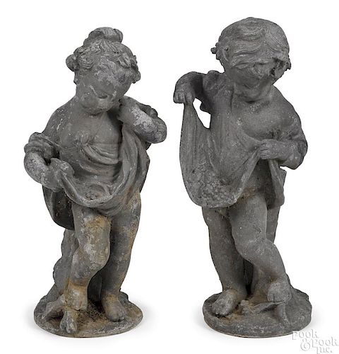 Pair of lead putti garden figures