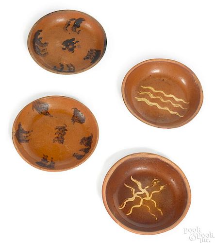 Four redware shallow bowls, 19th c.