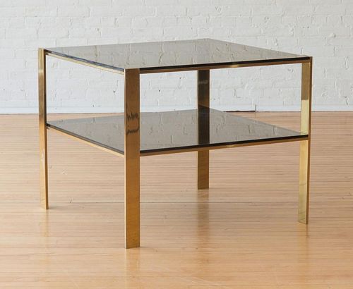 LARGE BRASS AND SMOKED GLASS END TABLE, IN THE STYLE OF BILLY BALDWIN