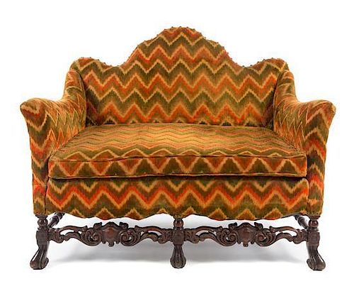 A Renaissance Revival Style Settee Height 37 x width 45 x depth 28 inches.