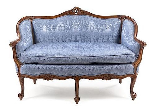 * A Louis XV Style Walnut Canape Height 33 3/8 x width 51 x depth 29 1/2 inches.