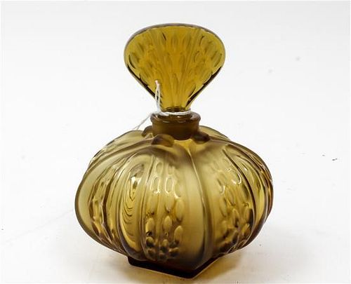 A Lalique Molded and Frosted Glass Perfume Bottle Height 6 1/4 inches.