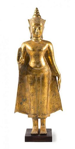A Thai Gilt Bronze Figure of Standing Buddha
