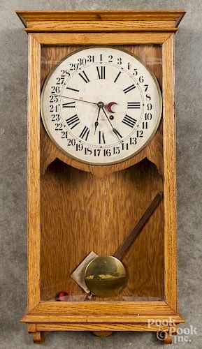 Seth Thomas oak wall clock.