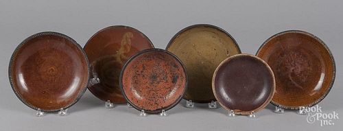 Six redware plates and shallow bowls, 19th c.